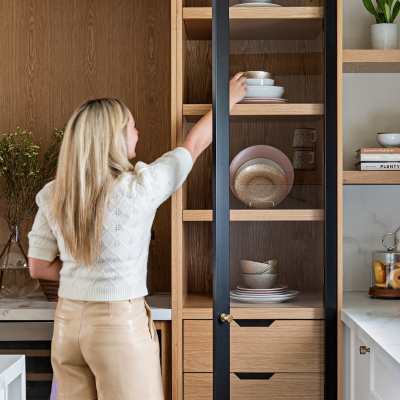 designer Lisa Kooistra staging kitchen shelving in small home